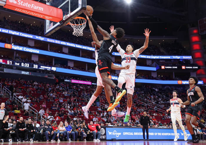 Rockets guard Jalen Green (4) shoots the ball as Washington Wizards guard Bilal Coulibaly (0) defends during the second quarter at Toyota Center.